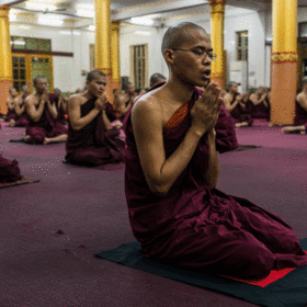Monks pray in the Bengala monastery in Yangon, Myanmar . (Adam Dean/The New York Times). 